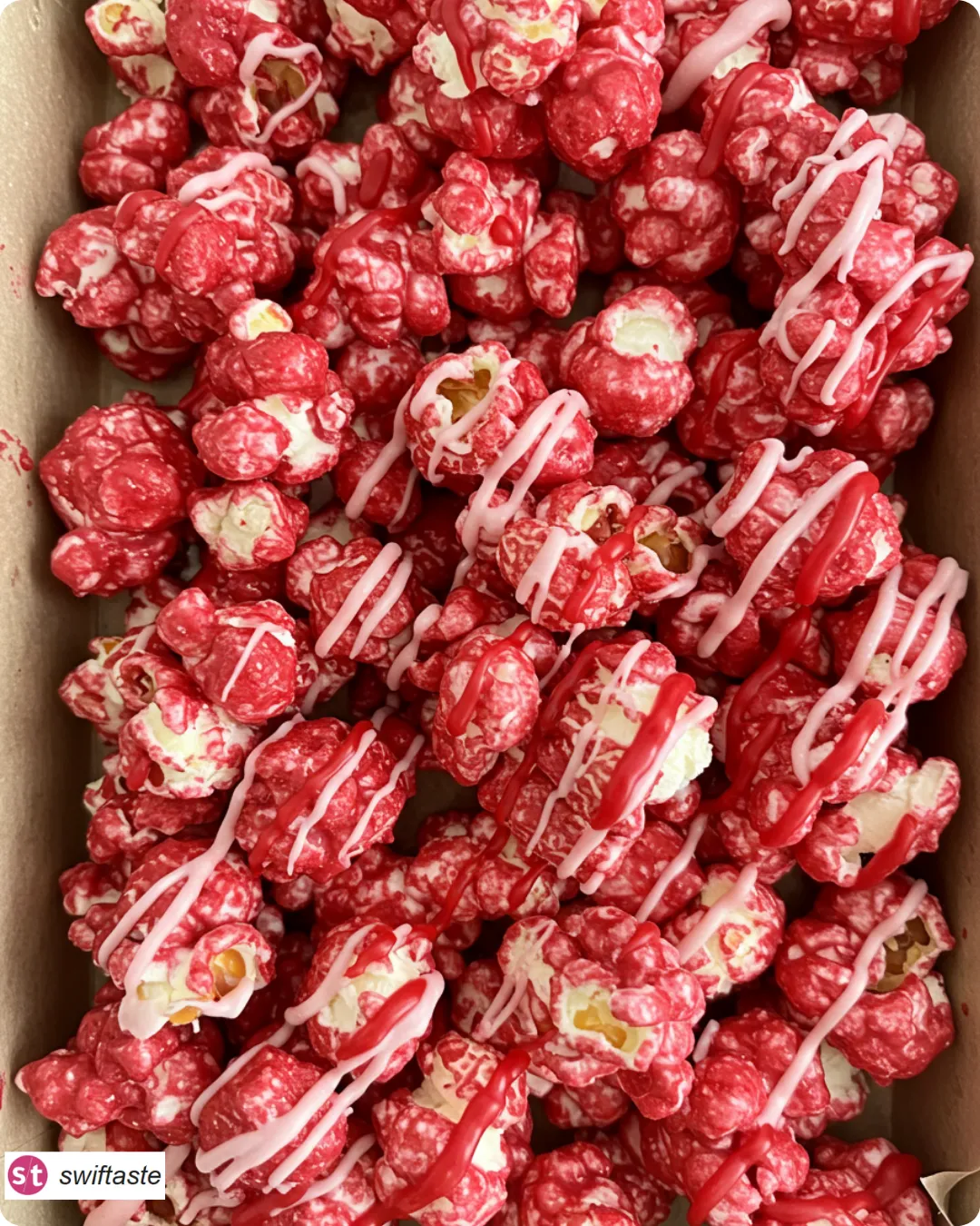 Bloody Red Velvet Popcorn with white chocolate and red “blood” drizzle