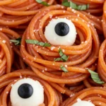 Bloody Spaghetti with Mozzarella Eyeballs in glossy red sauce