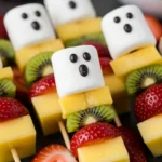 Ghost Fruit Skewers with marshmallow or banana ghosts and candy eyes