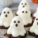 Ghostly Halloween Yogurt ghosts with chocolate chip eyes