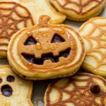 Halloween Pancakes with cocoa outlines and spooky shapes