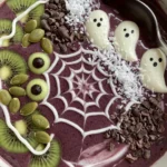 Served Halloween Smoothie Bowl with spider web and spooky toppings