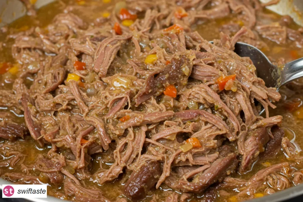 Mississippi Pot Roast shredded with pepperoncini and buttery jus