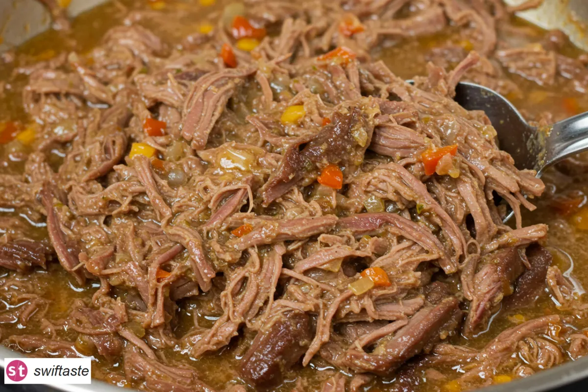 Mississippi Pot Roast shredded with pepperoncini and buttery jus