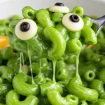 Monster Mac and Cheese with bright-green sauce and cheese eyes