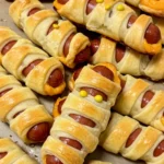 Mummy Pigs in a Blanket close‑up with crescent wraps