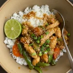 One Bowl Pure Comfort served with rice, sesame, and lime