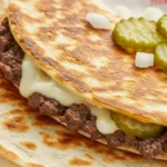Smashburger Quesadillas with lacy beef crust and melted cheese