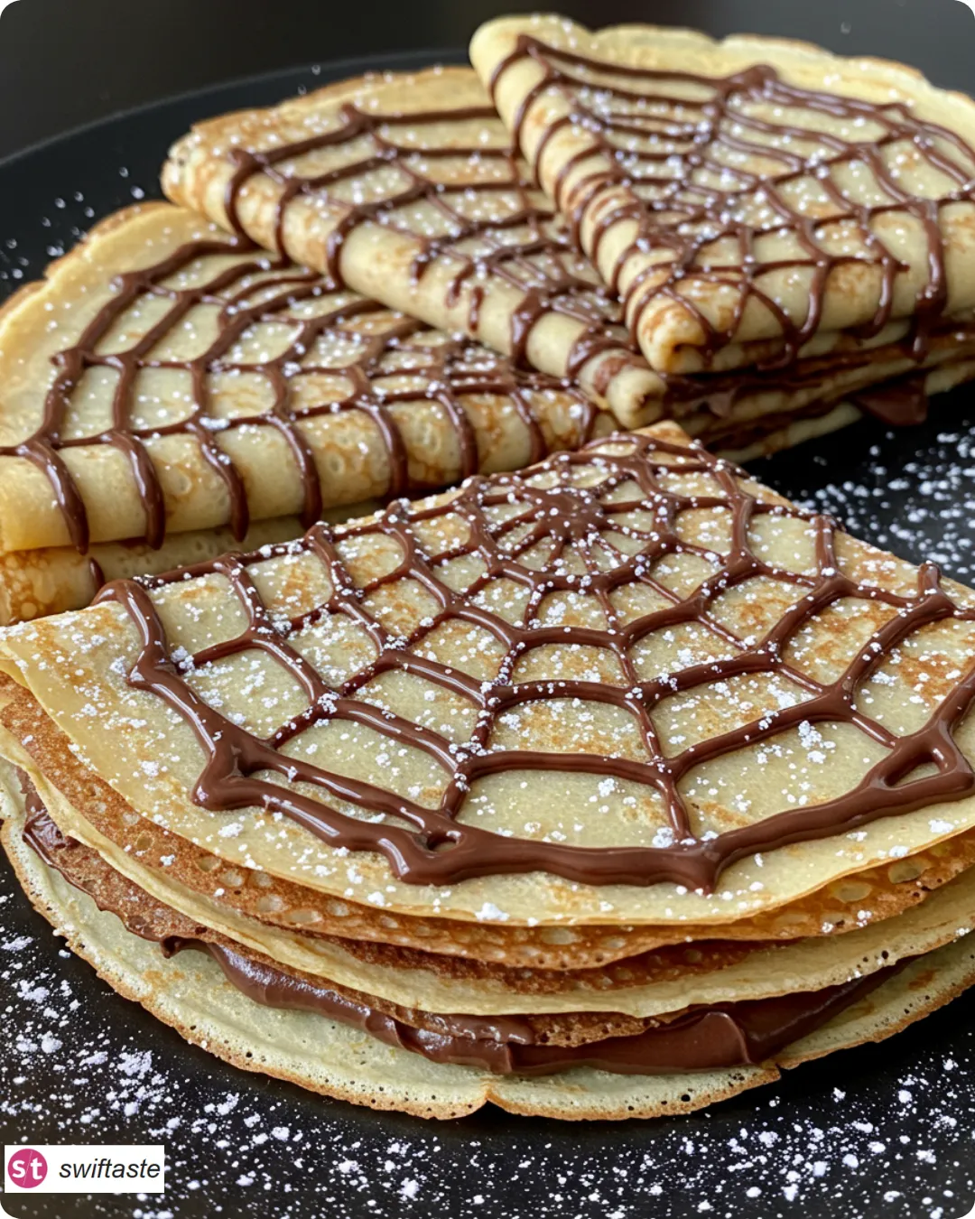 Spiderweb Crepes Treat lacy crepe webs with chocolate drizzle