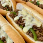 Ground Beef Philly Cheesesteaks with peppers, onions, and melted provolone