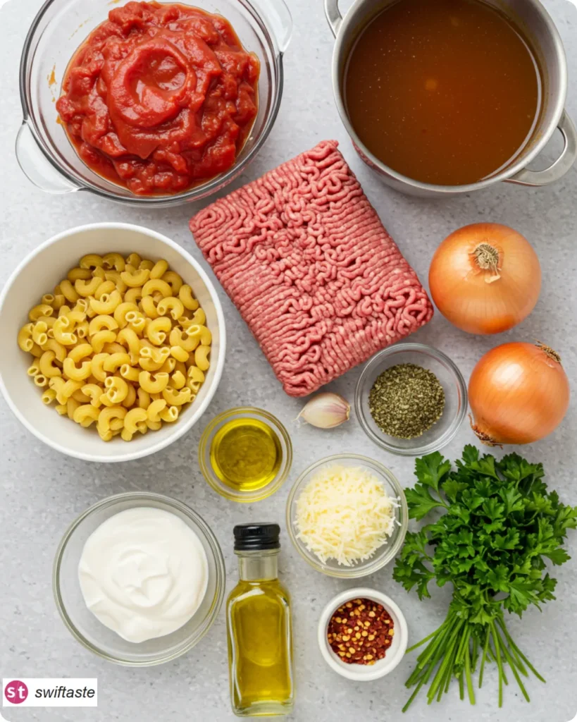 Ingredients for One-Pot Creamy Ground Beef Pasta laid out flat